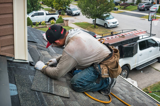 Professional Roofing technician working in Dale, IN